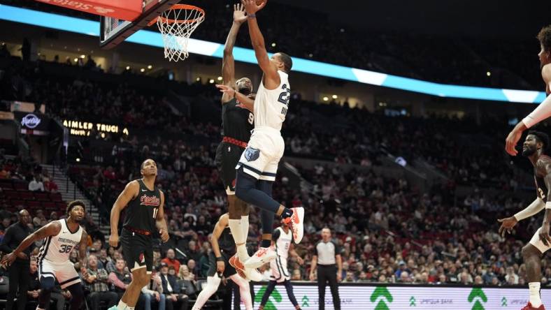 Nov 3, 2023; Portland, Oregon, USA; Memphis Grizzlies shooting guard Desmond Bane (22) shoots under pressure from Portland Trail Blazers small forward Jerami Grant (9) during the first half at Moda Center. Mandatory Credit: Soobum Im-USA TODAY Sports