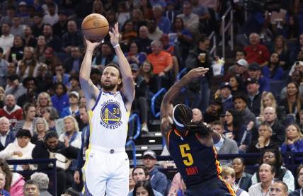 Nov 3, 2023; Oklahoma City, Oklahoma, USA; Golden State Warriors guard Stephen Curry (30) shoots a thee point basket against Oklahoma City Thunder guard Luguentz Dort (5) during the second half at Paycom Center.  Mandatory Credit: Alonzo Adams-USA TODAY Sports