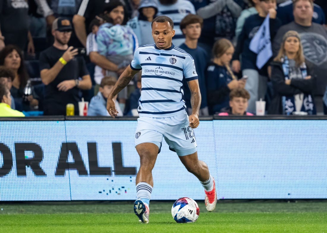 Oct 25, 2023; Kansas City, KS, USA; Sporting Kansas City defender Logan Ndenbe (18) controls the ball during the first half against the San Jose Earthquakes in the Western Conference Wild Card match of the 2023 MLS Cup Playoffs at Children's Mercy Park. Mandatory Credit: Jay Biggerstaff-USA TODAY Sports