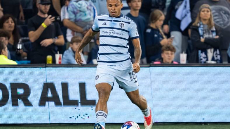 Oct 25, 2023; Kansas City, KS, USA; Sporting Kansas City defender Logan Ndenbe (18) controls the ball during the first half against the San Jose Earthquakes in the Western Conference Wild Card match of the 2023 MLS Cup Playoffs at Children's Mercy Park. Mandatory Credit: Jay Biggerstaff-USA TODAY Sports