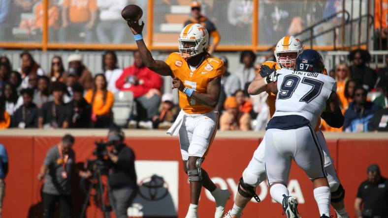 Nov 4, 2023; Knoxville, Tennessee, USA; Tennessee Volunteers quarterback Joe Milton III (7) passes the ball against the Connecticut Huskies during the first half at Neyland Stadium. Mandatory Credit: Randy Sartin-USA TODAY Sports