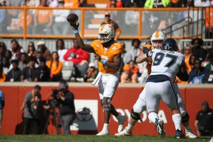 Nov 4, 2023; Knoxville, Tennessee, USA; Tennessee Volunteers quarterback Joe Milton III (7) passes the ball against the Connecticut Huskies during the first half at Neyland Stadium. Mandatory Credit: Randy Sartin-USA TODAY Sports