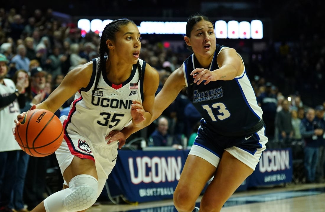 Nov 4, 2023; Storrs, CT, USA; UConn Huskies guard Azzi Fudd (35) drives the ball against Southern Connecticut State University guard Julianna Bonilla (13) in the first half at Gampel Pavillion. Mandatory Credit: David Butler II-USA TODAY Sports