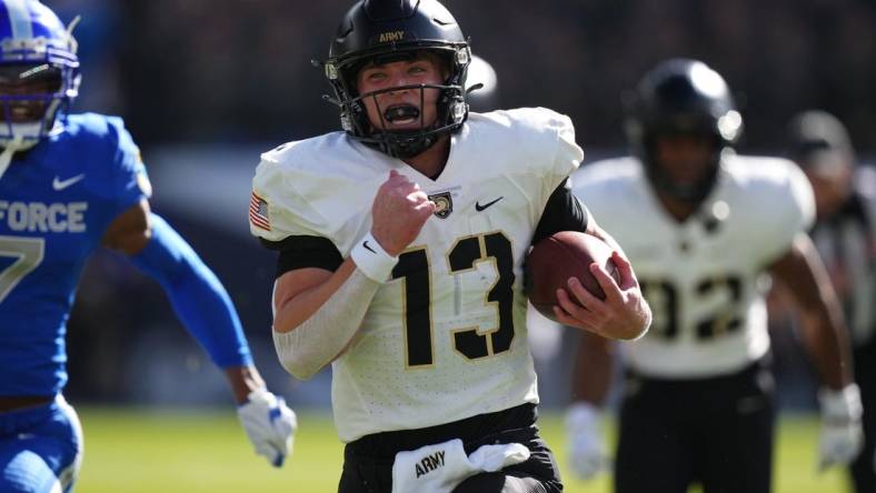 Nov 4, 2023; Denver, Colorado, USA; Army Black Knights quarterback Bryson Daily (13) carries for a 63 yard touchdown in the first quarter against the Air Force Falcons at Empower Field at Mile High. Mandatory Credit: Ron Chenoy-USA TODAY Sports