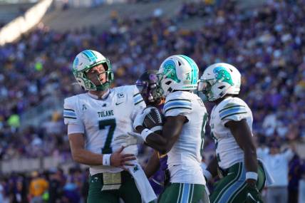 Nov 4, 2023; Greenville, North Carolina, USA; Tulane Green Wave wide receiver Lawrence Keys III (6) is congratulated by quarterback Michael Pratt (7) after his touchdown during the first half at Dowdy-Ficklen Stadium. Mandatory Credit: James Guillory-USA TODAY Sports