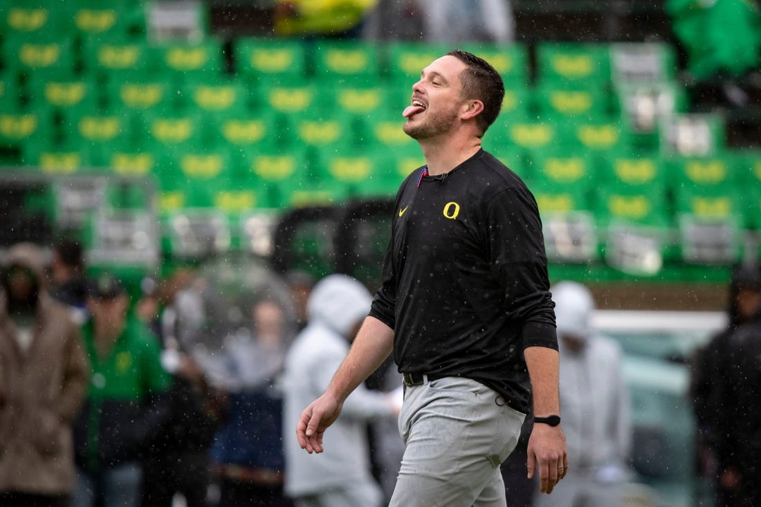 Oregon head coach Dan Lanning sticks his tongue out to catch the rain as the No. 6 Oregon Ducks host California Saturday, Nov. 4, 2023, at Autzen Stadium in Eugene, Ore.