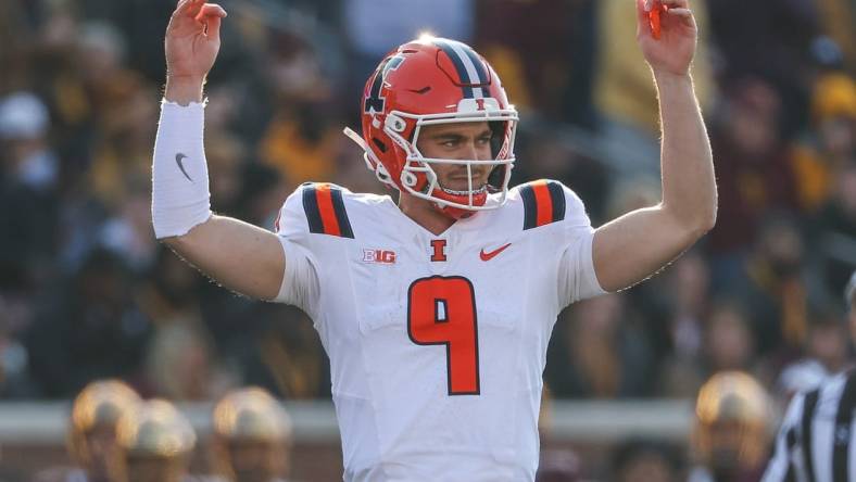 Nov 4, 2023; Minneapolis, Minnesota, USA; Illinois Fighting Illini quarterback Luke Altmyer (9) celebrates his touchdown pass to wide receiver Isaiah Williams (1) during the first half against the Minnesota Golden Gophers at Huntington Bank Stadium. Mandatory Credit: Matt Krohn-USA TODAY Sports