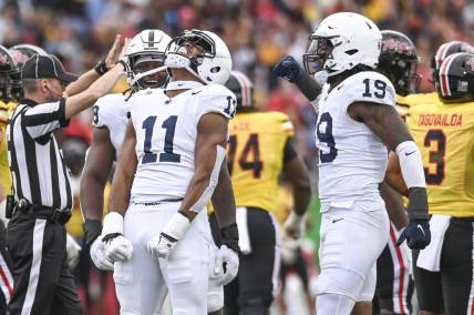 Nov 4, 2023; College Park, Maryland, USA;  Penn State Nittany Lions linebacker Abdul Carter (11) celebrates after sacking Maryland Terrapins quarterback Taulia Tagovailoa (3) dung the first half at SECU Stadium. Mandatory Credit: Tommy Gilligan-USA TODAY Sports