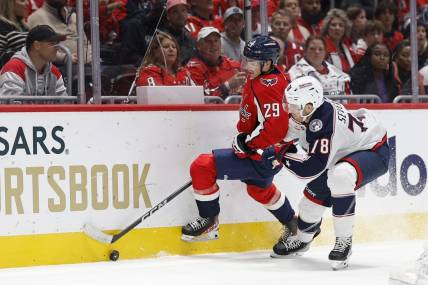 Nov 4, 2023; Washington, District of Columbia, USA; Washington Capitals center Hendrix Lapierre (29) and Columbus Blue Jackets defenseman Damon Severson (78) battle for the puck in the first period at Capital One Arena. Mandatory Credit: Geoff Burke-USA TODAY Sports