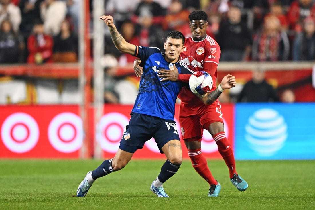 Nov 4, 2023; Harrison, NJ, USA; FC Cincinnati forward Brandon V  zquez (19) and New York Red Bulls defender Andr  s Reyes (4) battle for the ball during the first half of game two in a round one match of the 2023 MLS Cup Playoffs at Red Bull Arena. Mandatory Credit: Mark Smith-USA TODAY Sports