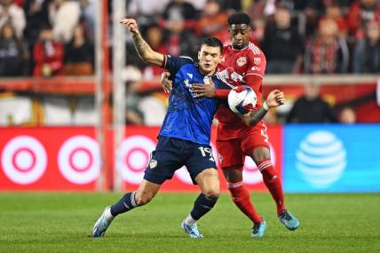 Nov 4, 2023; Harrison, NJ, USA; FC Cincinnati forward Brandon V  zquez (19) and New York Red Bulls defender Andr  s Reyes (4) battle for the ball during the first half of game two in a round one match of the 2023 MLS Cup Playoffs at Red Bull Arena. Mandatory Credit: Mark Smith-USA TODAY Sports