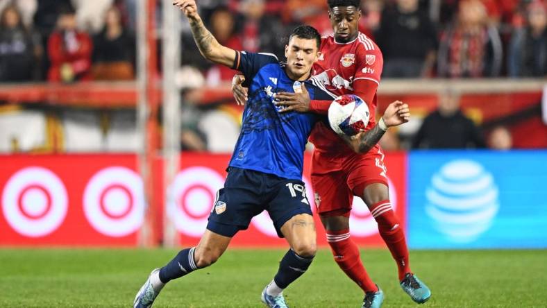 Nov 4, 2023; Harrison, NJ, USA; FC Cincinnati forward Brandon V  zquez (19) and New York Red Bulls defender Andr  s Reyes (4) battle for the ball during the first half of game two in a round one match of the 2023 MLS Cup Playoffs at Red Bull Arena. Mandatory Credit: Mark Smith-USA TODAY Sports