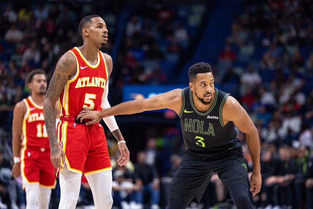 Nov 4, 2023; New Orleans, Louisiana, USA; New Orleans Pelicans guard CJ McCollum (3) guards Atlanta Hawks guard Dejounte Murray (5) during the first half at Smoothie King Center. Mandatory Credit: Stephen Lew-USA TODAY Sports