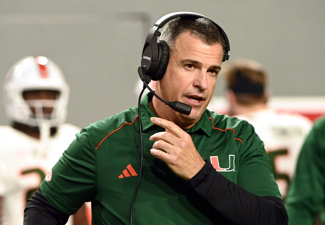 Nov 4, 2023; Raleigh, North Carolina, USA; Miami Hurricanes head coach Mario Cristobal looks on during the first half against the North Carolina State Wolfpack at Carter-Finley Stadium. Mandatory Credit: Rob Kinnan-USA TODAY Sports