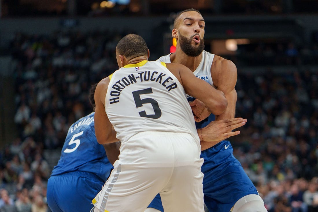 Nov 4, 2023; Minneapolis, Minnesota, USA; Minnesota Timberwolves center Rudy Gobert (27) sets a screen on Utah Jazz guard Talen Horton-Tucker (5) in the second quarter at Target Center. Mandatory Credit: Matt Blewett-USA TODAY Sports