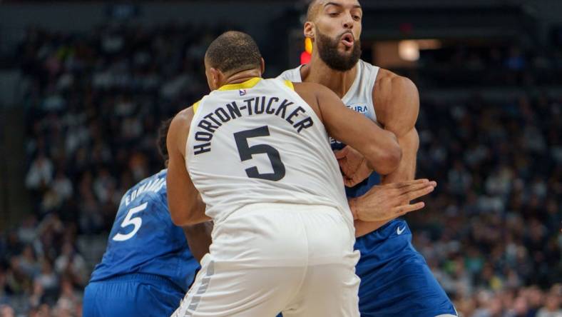 Nov 4, 2023; Minneapolis, Minnesota, USA; Minnesota Timberwolves center Rudy Gobert (27) sets a screen on Utah Jazz guard Talen Horton-Tucker (5) in the second quarter at Target Center. Mandatory Credit: Matt Blewett-USA TODAY Sports