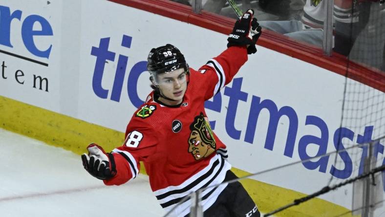 Nov 4, 2023; Chicago, Illinois, USA;  Chicago Blackhawks center Connor Bedard (98) celebrates after he scores a goal against the Florida Panthers during the second period at the United Center. Mandatory Credit: Matt Marton-USA TODAY Sports