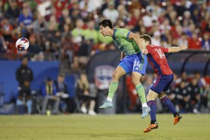 Nov 4, 2023; Frisco, Texas, USA; Seattle Sounders midfielder Josh Atencio (84) heads the ball against FC Dallas midfielder Asier Illarramendi (14) during the first half of game two in a round one match of the 2023 MLS Cup Playoffs at Toyota Stadium. Mandatory Credit: Andrew Dieb-USA TODAY Sports
