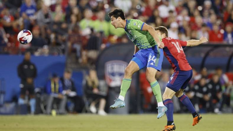 Nov 4, 2023; Frisco, Texas, USA; Seattle Sounders midfielder Josh Atencio (84) heads the ball against FC Dallas midfielder Asier Illarramendi (14) during the first half of game two in a round one match of the 2023 MLS Cup Playoffs at Toyota Stadium. Mandatory Credit: Andrew Dieb-USA TODAY Sports