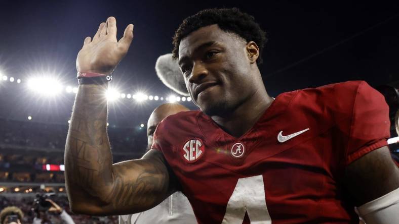 Nov 4, 2023; Tuscaloosa, Alabama, USA; Alabama Crimson Tide quarterback Jalen Milroe (4) waves to fans as he walks off the field during the second half at Bryant-Denny Stadium. Mandatory Credit: Butch Dill-USA TODAY Sports