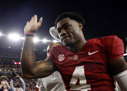 Nov 4, 2023; Tuscaloosa, Alabama, USA; Alabama Crimson Tide quarterback Jalen Milroe (4) waves to fans as he walks off the field during the second half at Bryant-Denny Stadium. Mandatory Credit: Butch Dill-USA TODAY Sports