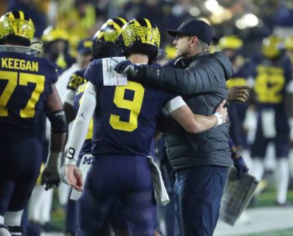 Michigan coach Jim Harbaugh meets quarterback J.J. McCarthy after a touchdown against Purdue during the second half of Michigan's 41-13 win on Saturday, Nov 4, 2023, in Ann Arbor.
