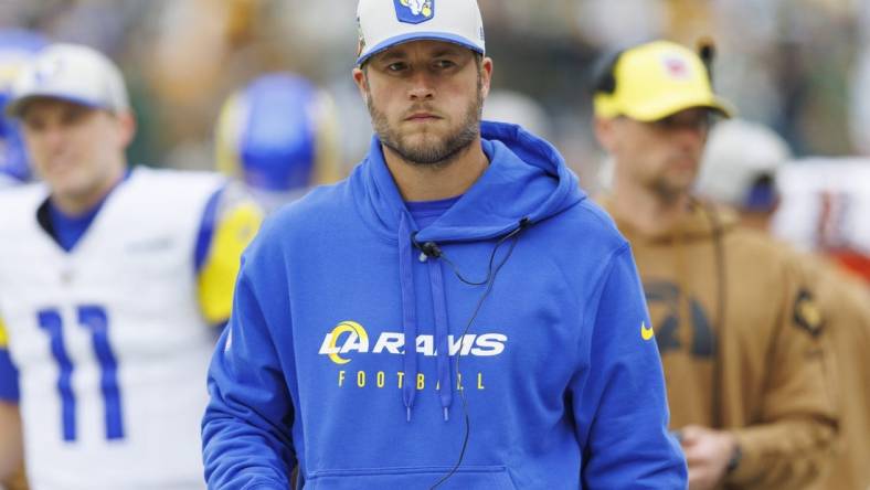 Nov 5, 2023; Green Bay, Wisconsin, USA;  Los Angeles Rams quarterback Matthew Stafford looks on from the sidelines prior to the game against the Green Bay Packers at Lambeau Field. Mandatory Credit: Jeff Hanisch-USA TODAY Sports