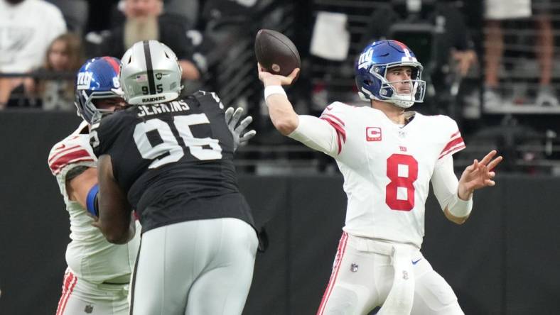 November 5, 2023; Paradise, Nevada, USA; New York Giants quarterback Daniel Jones (8) passes the football against the Las Vegas Raiders during the first quarter at Allegiant Stadium. Mandatory Credit: Kyle Terada-USA TODAY Sports