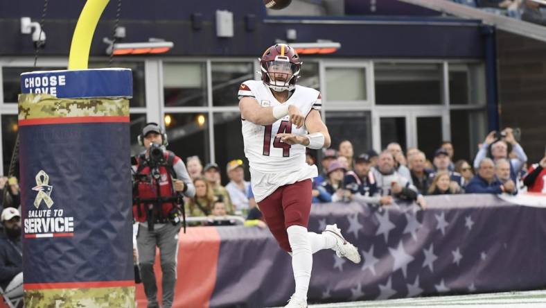 Nov 5, 2023; Foxborough, Massachusetts, USA;  Washington Commanders quarterback Sam Howell (14) throws the ball during the second half against the New England Patriots at Gillette Stadium. Mandatory Credit: Bob DeChiara-USA TODAY Sports