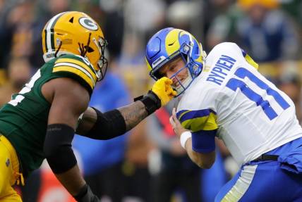 Green Bay Packers linebacker Rashan Gary (52) grabs the facemask of Los Angeles Rams quarterback Brett Rypien (11) during their football game Sunday, November 5, 2023, at Lambeau Field in Green Bay, Wis. Gary was penalized on the play.
Dan Powers/USA TODAY NETWORK-Wisconsin.