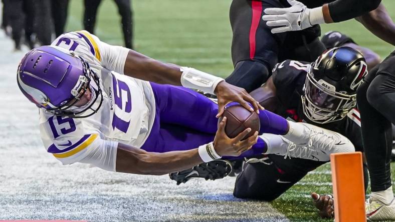 Nov 5, 2023; Atlanta, Georgia, USA; Minnesota Vikings quarterback Joshua Dobbs (15) dives trying to reach the pylon against the Atlanta Falcons during the first half at Mercedes-Benz Stadium. Mandatory Credit: Dale Zanine-USA TODAY Sports