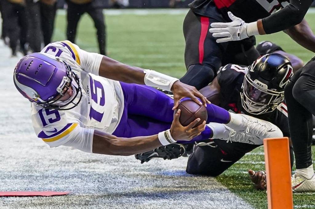 Nov 5, 2023; Atlanta, Georgia, USA; Minnesota Vikings quarterback Joshua Dobbs (15) dives trying to reach the pylon against the Atlanta Falcons during the first half at Mercedes-Benz Stadium. Mandatory Credit: Dale Zanine-USA TODAY Sports