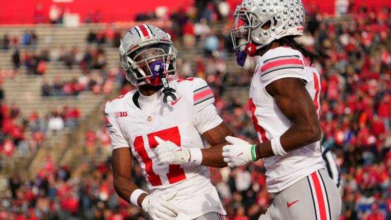 Nov 4, 2023; Piscataway, New Jersey, USA; Ohio State Buckeyes wide receiver Carnell Tate (17) congratulates wide receiver Marvin Harrison Jr. (18) after he scored a touchdown during the NCAA football game against the Rutgers Scarlet Knights at SHI Stadium. Ohio State won 35-16.