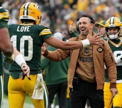 Green Bay Packers quarterback Jordan Love (10) is hugged by head coach Matt LaFleur after throwing a touchdown pass during the fourth quarter of their game at Lambeau Field Sunday, November 5, 2023 in Green Bay, Wisconsin. The Green Bay Packers beat the Los Angeles Rams 20-3.