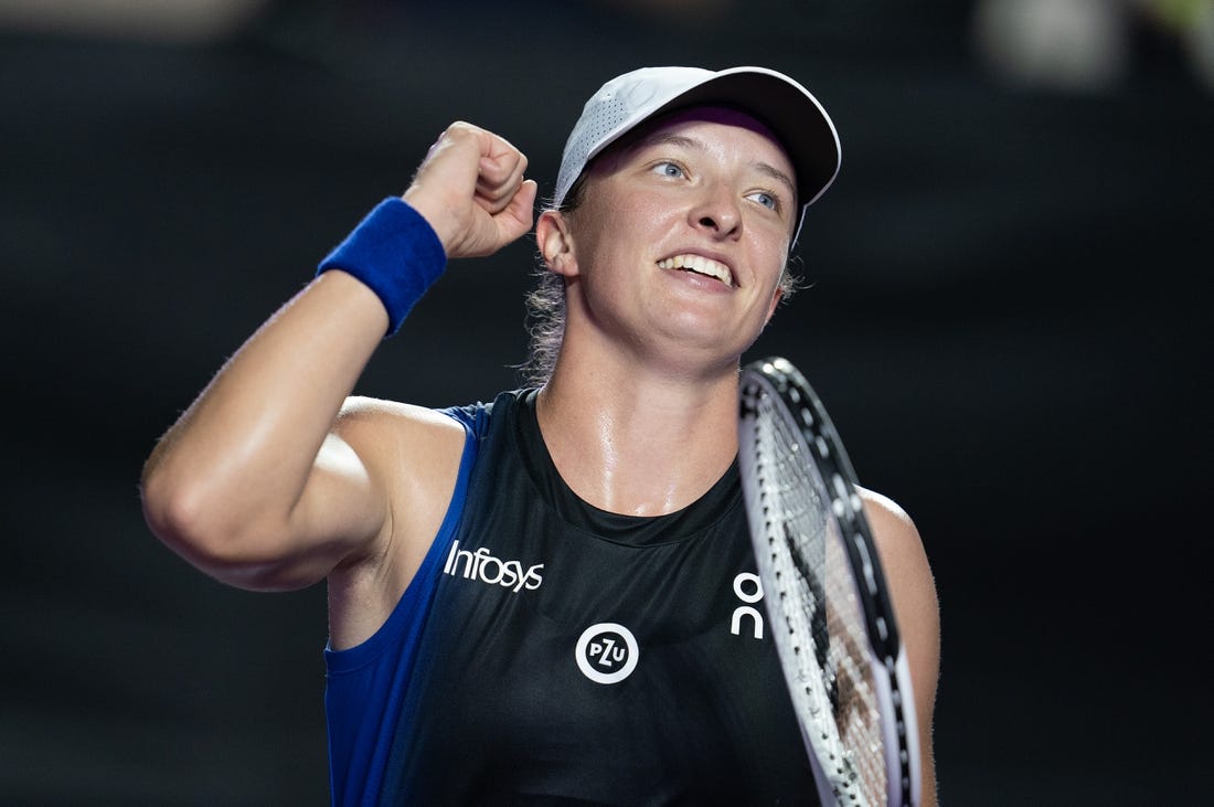 Nov 5, 2023; Cancun, Mexico; Iga Swiatek (POL) celebrates winning her match against Aryna Sabalenka (BLR) on day eight of the GNP Saguaros WTA Finals Cancun. Mandatory Credit: Susan Mullane-USA TODAY Sports