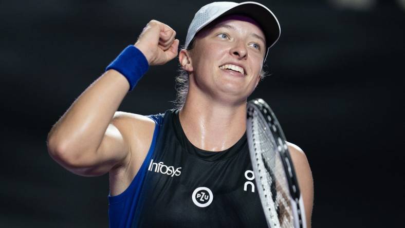 Nov 5, 2023; Cancun, Mexico; Iga Swiatek (POL) celebrates winning her match against Aryna Sabalenka (BLR) on day eight of the GNP Saguaros WTA Finals Cancun. Mandatory Credit: Susan Mullane-USA TODAY Sports