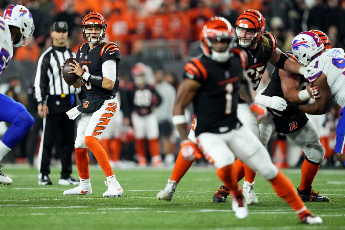 Nov 5, 2023; Cincinnati, Ohio, USA; Cincinnati Bengals quarterback Joe Burrow (9) look toward wide receiver Ja'Marr Chase (1) while he runs a route in the fourth quarter against the Buffalo Bills at Paycor Stadium. Mandatory Credit: Kareem Elgazzar-USA TODAY Sports