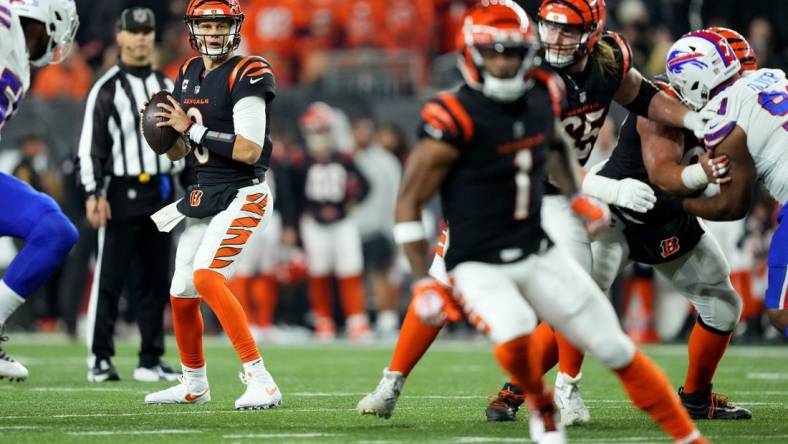 Nov 5, 2023; Cincinnati, Ohio, USA; Cincinnati Bengals quarterback Joe Burrow (9) look toward wide receiver Ja'Marr Chase (1) while he runs a route in the fourth quarter against the Buffalo Bills at Paycor Stadium. Mandatory Credit: Kareem Elgazzar-USA TODAY Sports