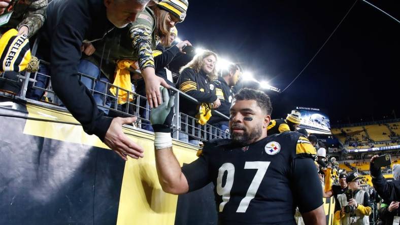 Nov 2, 2023; Pittsburgh, Pennsylvania, USA;  Pittsburgh Steelers defensive tackle Cameron Heyward (97) greets fans after defeating the Tennessee Titans at Acrisure Stadium. Mandatory Credit: Charles LeClaire-USA TODAY Sports