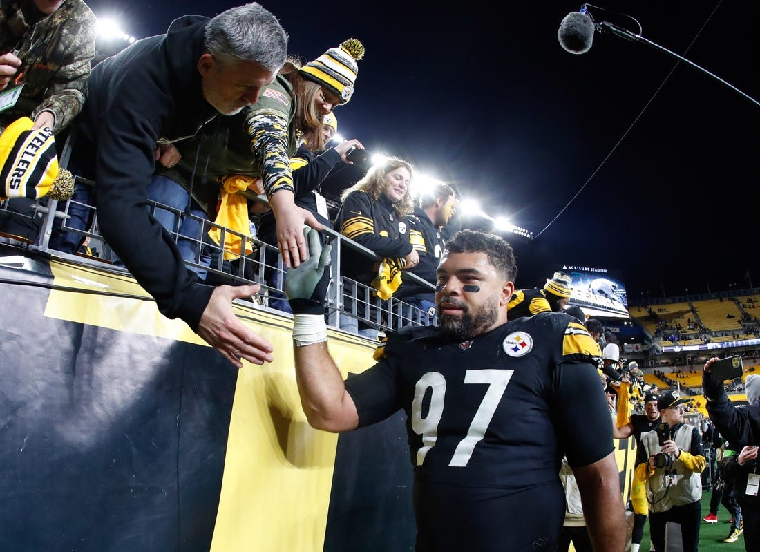 Nov 2, 2023; Pittsburgh, Pennsylvania, USA;  Pittsburgh Steelers defensive tackle Cameron Heyward (97) greets fans after defeating the Tennessee Titans at Acrisure Stadium. Mandatory Credit: Charles LeClaire-USA TODAY Sports