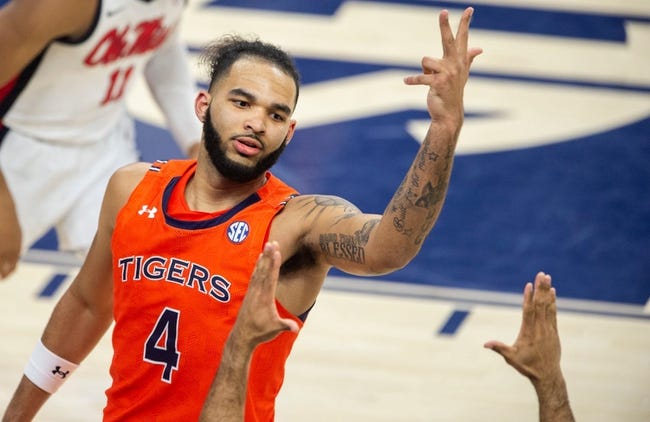 Auburn Tigers forward Johni Broome (4) celebrates his three-pointer as Auburn Tigers take on Ole Miss Rebels at Neville Arena in Auburn, Ala., on Wednesday, Feb. 22, 2023. Auburn Tigers defeated Ole Miss Rebels 78-74.