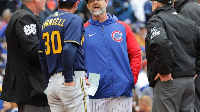 Chicago Cubs manager David Ross and Milwaukee Brewers manager Craig Counsell (30) meet before their game Thursday, April , 2022 at Wrigley Field in Chicago, Ill.MARK HOFFMAN/MILWAUKEE JOURNAL SENTINEL