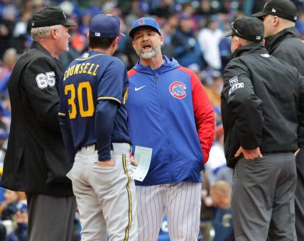 Chicago Cubs manager David Ross and Milwaukee Brewers manager Craig Counsell (30) meet before their game Thursday, April , 2022 at Wrigley Field in Chicago, Ill.MARK HOFFMAN/MILWAUKEE JOURNAL SENTINEL