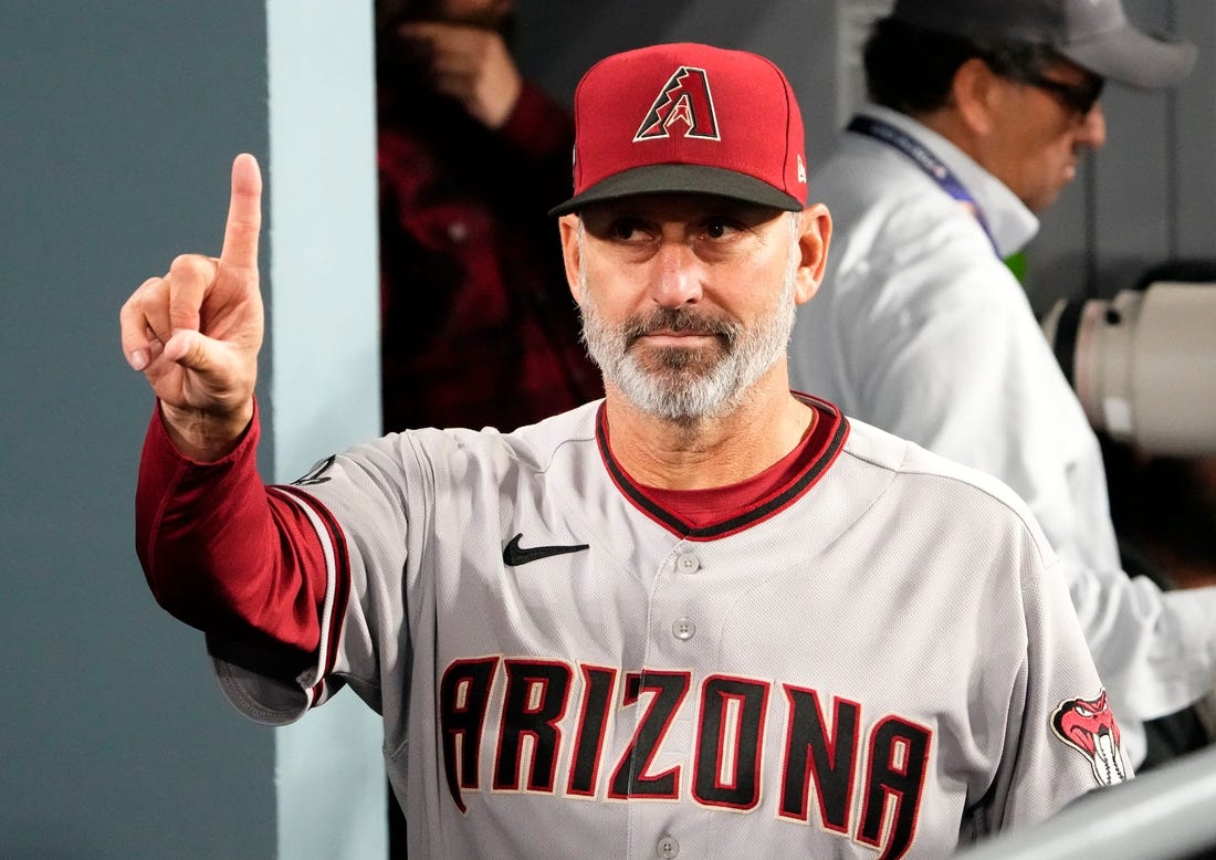 Arizona Diamondbacks manager Torey Lovullo (17) gestures after defeating the Los Angeles Dodgers 4-2 during Game 2 of the NLDS at Dodger Stadium in Los Angeles on Oct. 9, 2023.