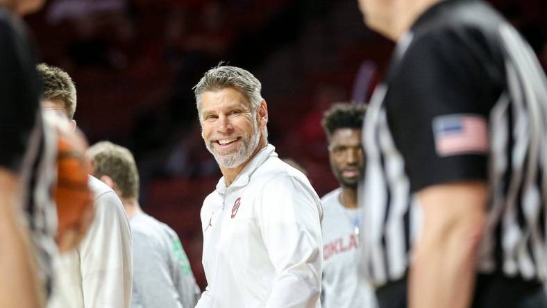 Oklahoma head coach Porter Moser smiles at referees in the second half during a basketball game between The Oklahoma Sooners (OU) and Kansas State Wildcats at the Lloyd Noble Center in Norman, Okla., Tuesday, Feb. 14, 2023.