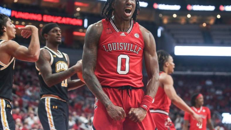 Louisville Cardinals guard Mike James (0) yells after drawing the foul against UMBC Monday night at the Cardinals men's basketball season opener. Nov.6, 2023.