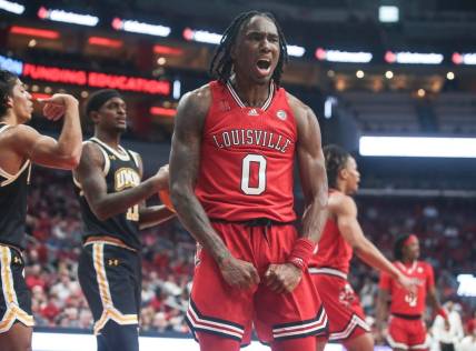 Louisville Cardinals guard Mike James (0) yells after drawing the foul against UMBC Monday night at the Cardinals men's basketball season opener. Nov.6, 2023.