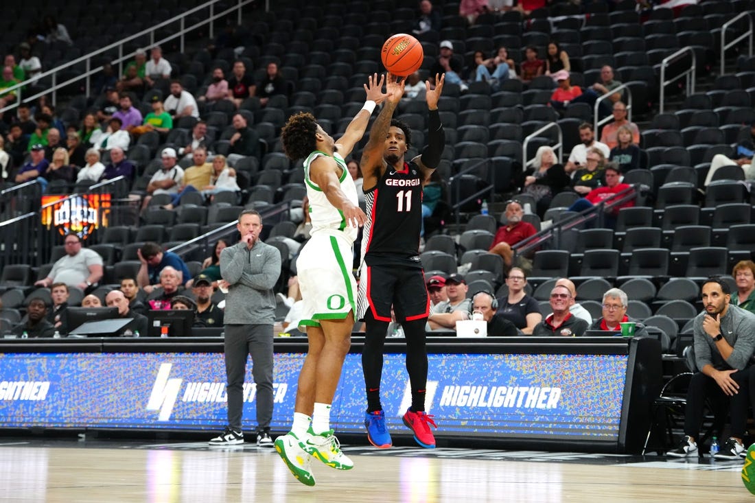 Nov 6, 2023; Las Vegas, Nevada, USA; Georgia Bulldogs guard Justin Hill (11) shoots against Oregon Ducks guard Jadrian Tracey (22) during the second half at T-Mobile Arena. Mandatory Credit: Stephen R. Sylvanie-USA TODAY Sports