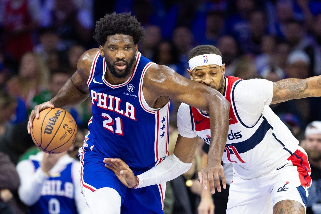 Nov 6, 2023; Philadelphia, Pennsylvania, USA; Philadelphia 76ers center Joel Embiid (21) collides with Washington Wizards forward Daniel Gafford (21) while bringing the ball up court during the first quarter at Wells Fargo Center. Mandatory Credit: Bill Streicher-USA TODAY Sports