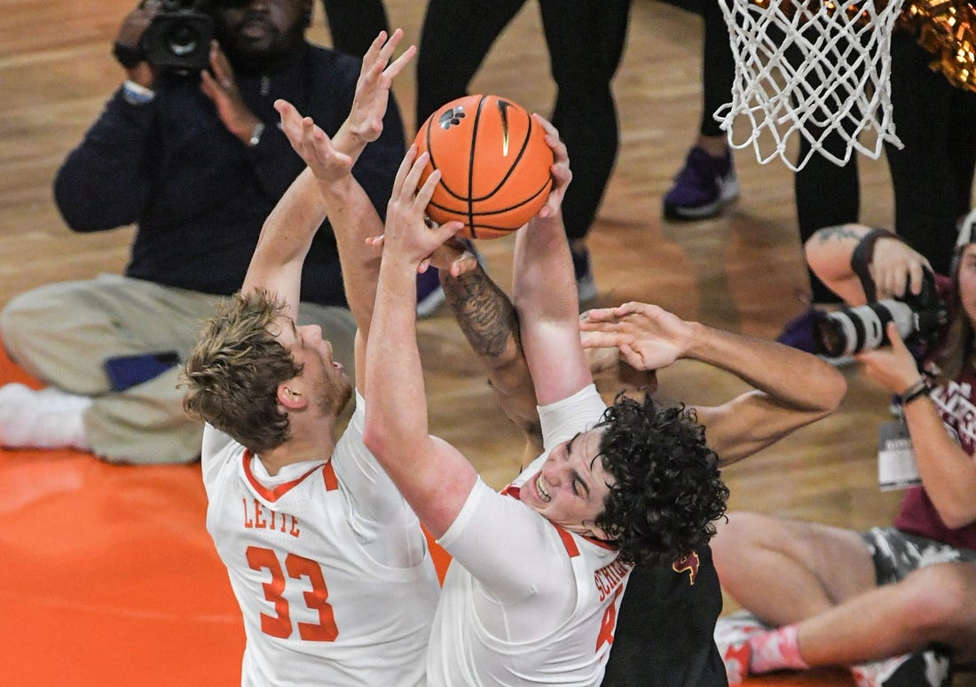 Clemson junior forward Ian Schieffelin (4) rebounds near teammate graduate Bas Leyte (33) during the first half at Littlejohn Coliseum in Clemson, S.C. Monday, November 6, 2023.